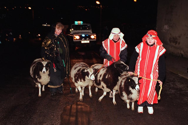 Members from Christchuch, Stannington, re-enacted the nativity with a nativity tour of the village complete with real animals. in 1998 The Baines family take the sheep to the crown and glove car park. They are left to right Jackie Baines , 14 year old Jessica and 12 year old Josie.