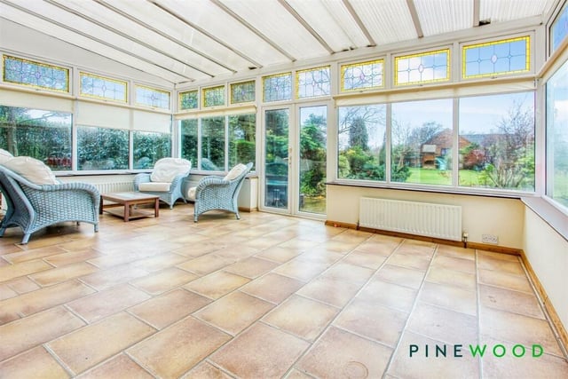Enjoy looking at the garden, whatever the weather,  in the comfort of this spacious conservatory.
