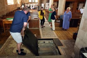 The public will be able to tour the crypt at Bolsover Parish Church during the middle two weekends in September. Watching the entrance hatch being lifted are Graysons staff Meriet Watts (centre), Lacey Bates-Blinko, Belinda Lancaster and the Fame, Fashion and Fortune project’s Amanda Boler.