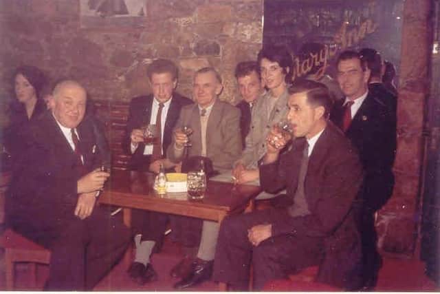 Samuel Arthur Clarke, left, with some of his men who were decorating Brocklehurst Motors property in Jersey.