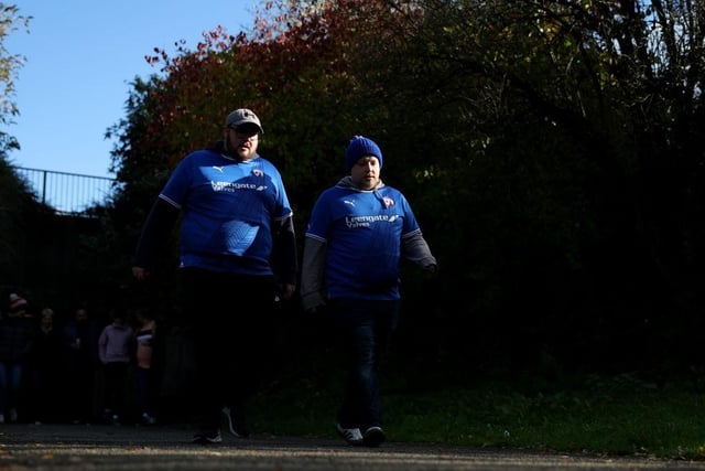 Fans make their way to the stadium ahead of the Emirates FA Cup First Round match between Chesterfield and Portsmouth.
