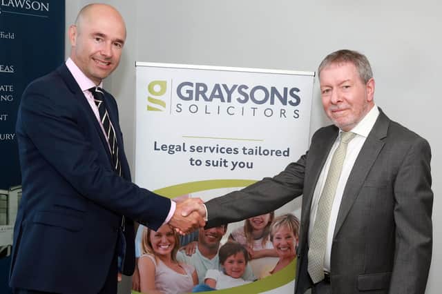 Favells’ director Timothy Gaubert, left, with Peter Clark, managing partner at Graysons.