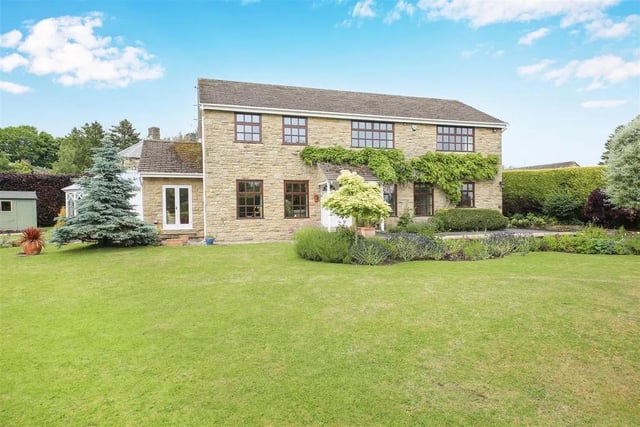 With four bedrooms and two bathrooms, this detached property is valued at £895,000.