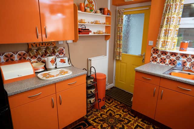 Martin Aylett, 51, has laid brown and orange kitchen tiles to go with his 1974 Russell Hobbs toaster and orange kitchen units.