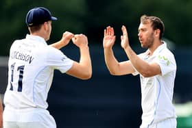 Alex Hughes celebrates with Ben Aitchison after taking the wicket of Tim Bresnan. (Photo by David Rogers/Getty Images)