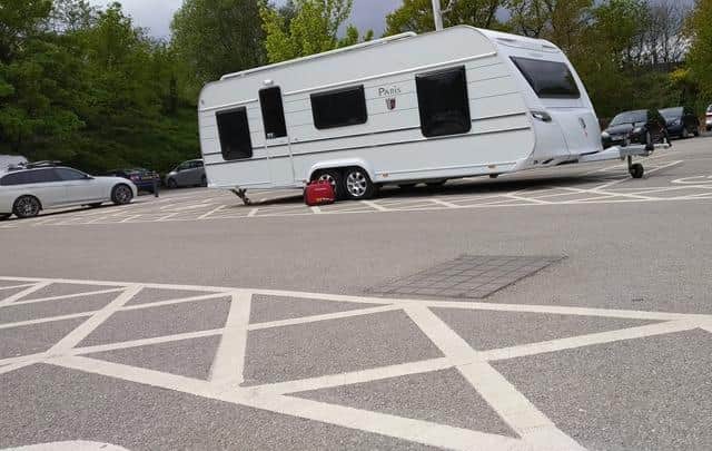 The caravan has reportedly been left across disabled bays at the Sainsbury's supermarket on Rother Way