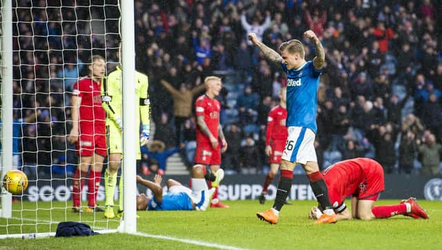 Rangers' Jason Cummings celebrates as Falkirk's Aaron Muirhead hits the ball into his own net in the last meeting of the two sides