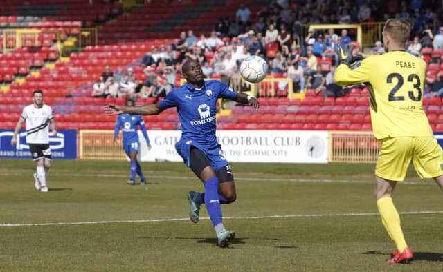 Chesterfield's Marc-Antoine Fortune tries to get on the end of a long ball during the last match between the two sides on 19/04/19.
