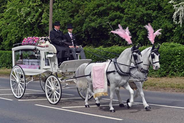 Lucy was brought to the crematorium in a white carriage pulled by two horses.