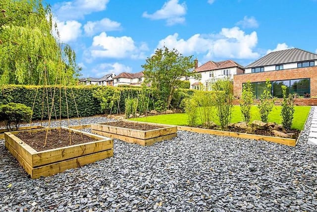 The garden also has planting beds and vegetable patches.