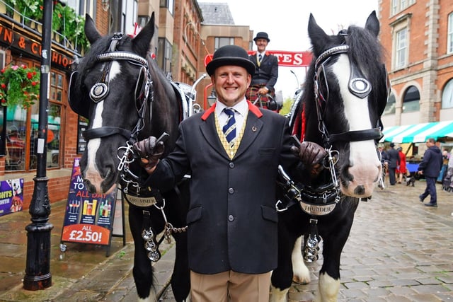 Phillip Williams and Richard Groom with Thwaites Brewery drayhorses