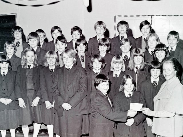Ripley Mill Hill school pupils present a cheque to Barnardos, July 1981.