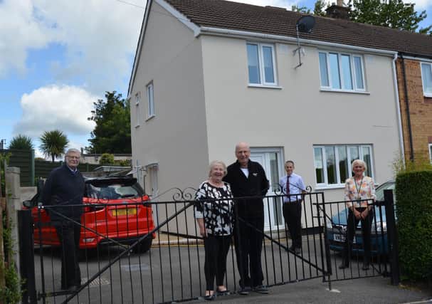 Marilyn and Michael Bailey outside their revamped home on the Hurst Farm estate with district councillors Steve Flitter (left) and Susan Hobson and director of housing Rob Cogings.