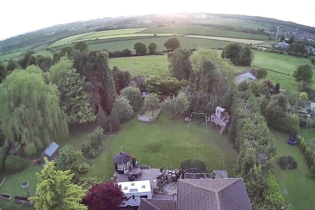 We close our photo gallery with this bird's eye view, showing the rear of the £960,000 property and the breathtaking scenery beyond.