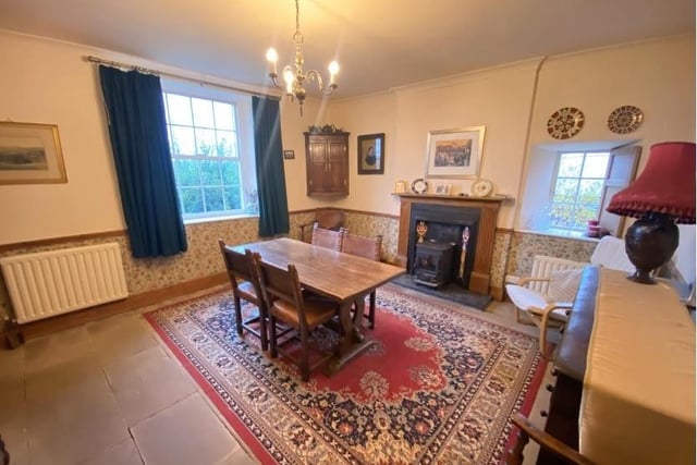 Diners can enjoy views over the front garden and the surrounding countryside beyond from this room which has flagstone flooring and a multi-fuel cast iron stove set in a wooden fire surround.