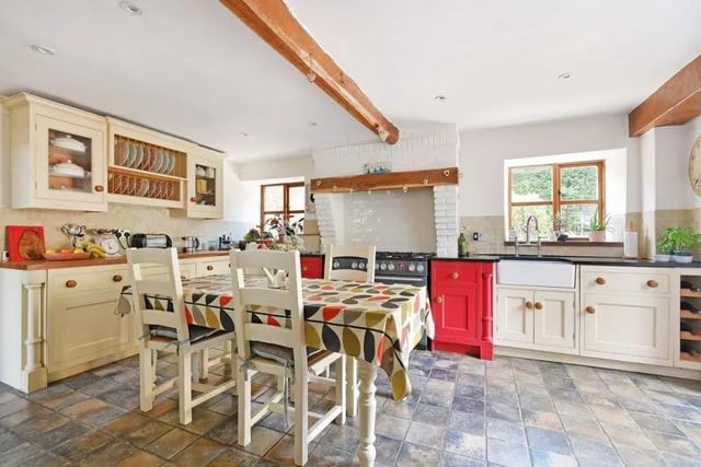 This bespoke kitchen is very large and features a number of handmade, solid wood cabinetry and lovely granite worktops. There is a breakfast island, but also plenty of space for a table if you wish to make it a kitchen/diner.