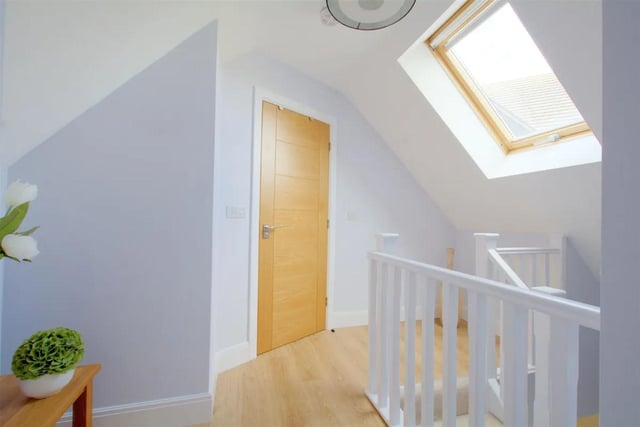 The stairs lead from the rear hallway to the landing in the guest suite and the balustrade is continued onto the landing, keylite window with a fitted blind to the ceiling and laminate flooring.