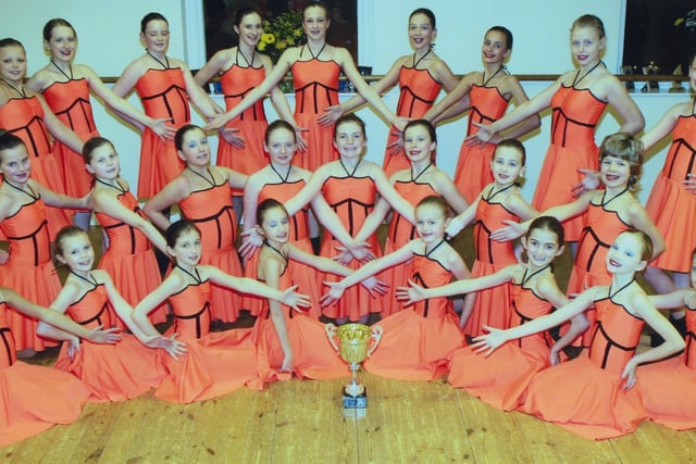 Proud pupils of Kickers Dance Studio, Chesterfield, with a trophy in 2006.