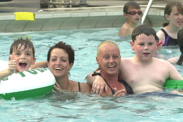 Jacob Wesley, Anna Weslery, Joe Brown and Michelle Bragger  enjoy the 84 degree temeprature of the outdoor pool at Hathersage in 2003