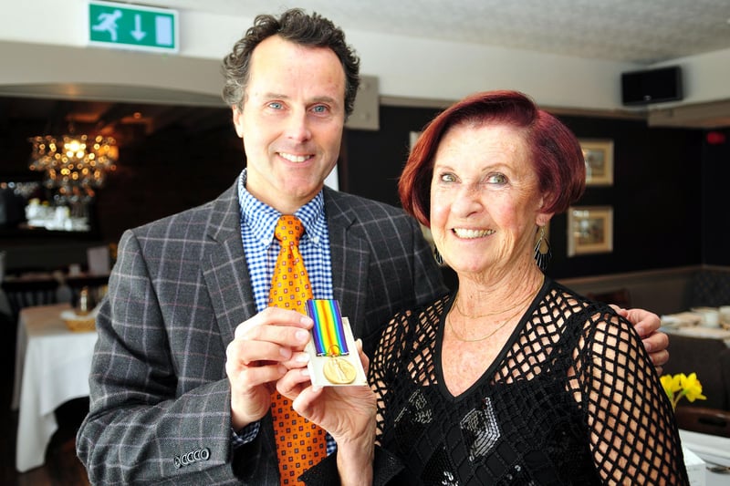 Adam Schoon from the Antiques Roadshow with Julia Patterson, chairman of Hartlepool district of the NSPCC, as they look at a First World War medal belonging to Julia's father-in-law.