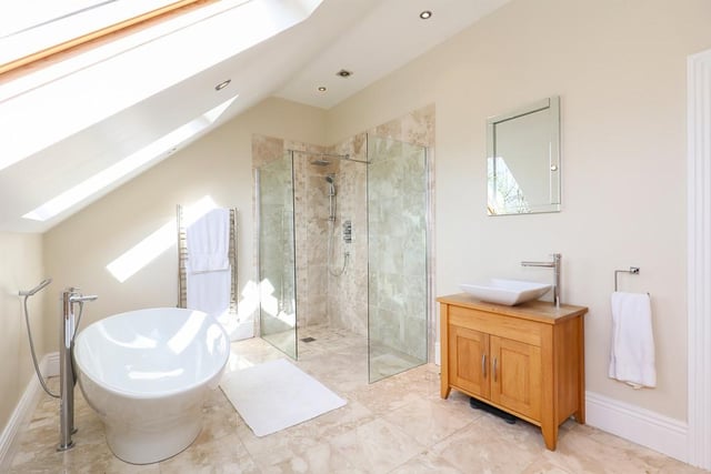 The second floor of the property is taken up by a bedroom, dressing room, storage room and this magnificent bathroom with a freestanding tub.