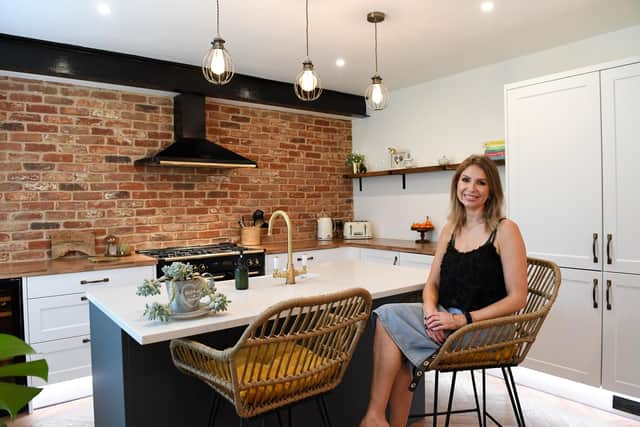 Joanna Holmes-Brangaghan relaxes in her prize-winning kitchen (photo: Jane Russell Photography for Wayfair UK)