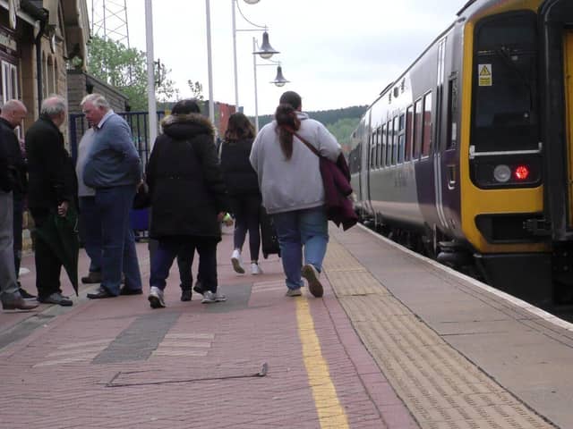 People catching a train on the Robin Hood Line