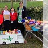 Pupils and teachers at Brimington Junior Schools have been invited to take part in the Easter Foodbank challenge in a bid to support struggling families across Chesterfield. Pictured are Sophie, Jessica and Thea from Brimington Junior School together with Jacqueline DeVeaux, communications, engagement and finding manager of the Chesterfield Foodbank.