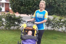 Katie Waine and her son Isaac ahead of the virtual London Marathon.