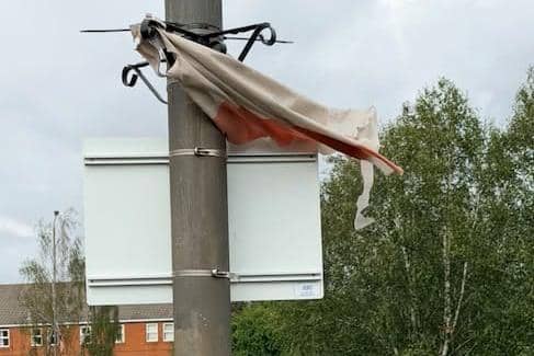 Deteriorating England flags on lampposts in Erewash. Image from Greg Maskalick.