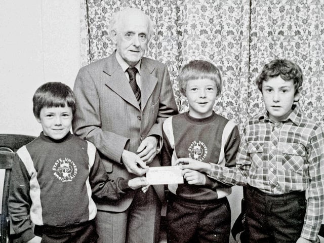 Heanor boys present a cheque to Heanor League of Friends, August 1981.