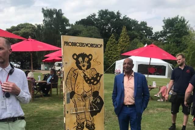 Raj Bisram from Antiques Roadshow with the painted door at Wollaton Park, Nottingham.