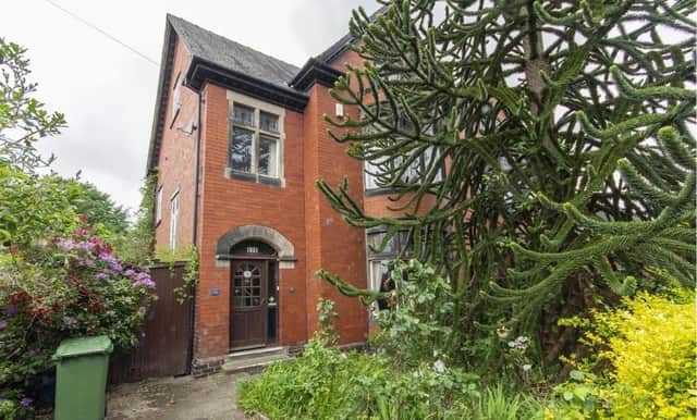 The semi-detached property has a front garden containing a monkey puzzle tree. There is  car standing space.