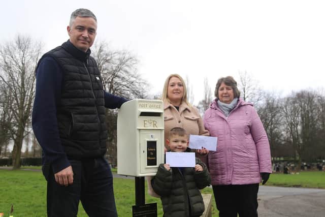 Cllr Allan Ogle and Staveley residents with the towns new Letters to Heaven post box.