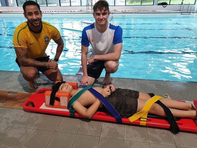 Pictured (from left): NEDDC lifeguards Daniel Clay and Joshua Ward, with ‘casualty’ Rhivan.