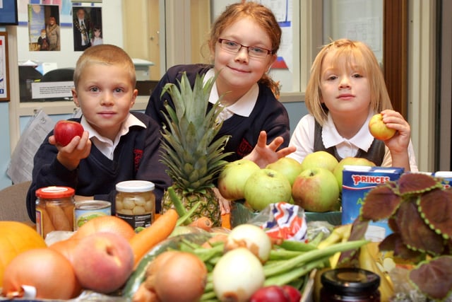 Oliver Emment, 7, Maisy Ainsworth, 8 and Erin Leece, 6, at Calow Primary School in 2008.