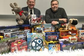 Chesterfield FC's chairman Mike Goodwin, right, and vice-chairman Martin Thacker with some of the toys which were donated.