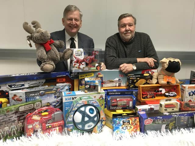 Chesterfield FC's chairman Mike Goodwin, right, and vice-chairman Martin Thacker with some of the toys which were donated.
