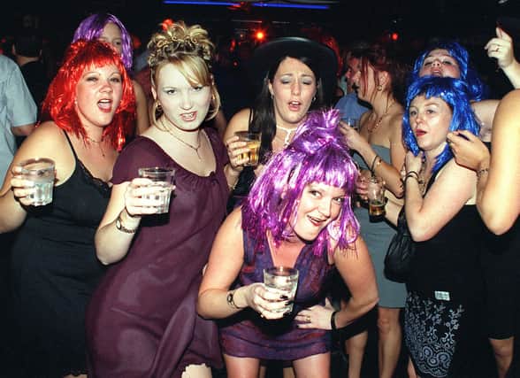 Sparkly wigs and drinks in hand -  a fun night in 1999