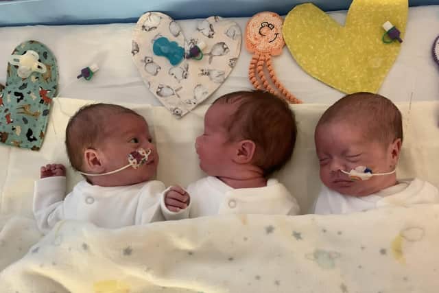 Out of incubators and sharing a cot on June 17, the triplets Atlanta, Bella and Rain were reunited for the first time since birth.