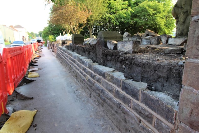 The first layers of brickwork are re-laid. A special lime-based mortar is used to hold the bricks and masonry together - as is the norm in church buildings.