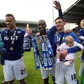 Chesterfield's players and children make a great snap for the family album after Spireites win the League Two title in 2014.