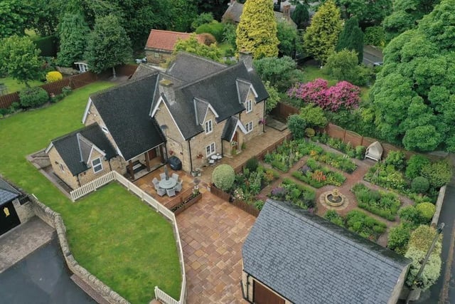 Featuring four bedrooms and a large, decorated garden area, this property is worth £950,000.