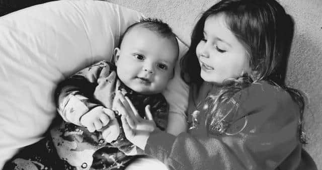 Oliver with his sister Harper.