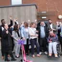 Darren and Adam are cheered on as they cut the ribbon at Linnet Mews!