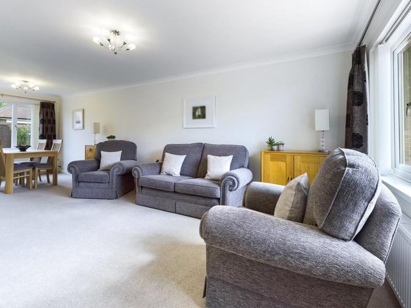 Lounge/dining room - Double aspect room with uPVC double glazed window to the front elevation, feature fireplace with inset and raised hearth incorporating electric fire unit, uPVC double glazed window to the rear elevation, two radiator panels and power points.