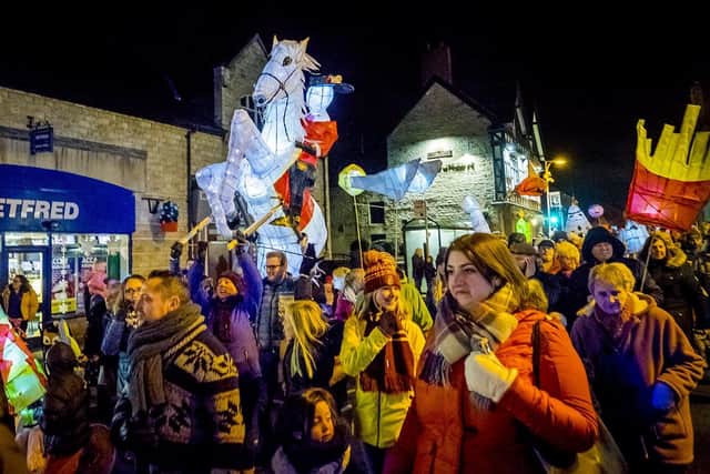 Families proudly display their handcrafted lanterns in the 2017 parade through Bolsover.