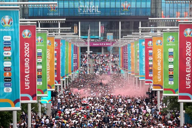 Supporters walk down Olympic Way during the UEFA Euro 2020 Championship Final between Italy and England at Wembley Stadium on July 11, 2021 in London, England. Photo by Alex Pantling/Getty Images.