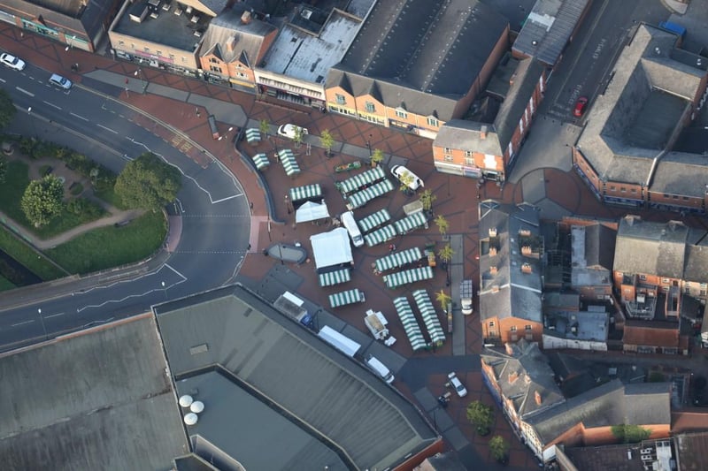 Looking down on the striped stall canopies on the Market Place