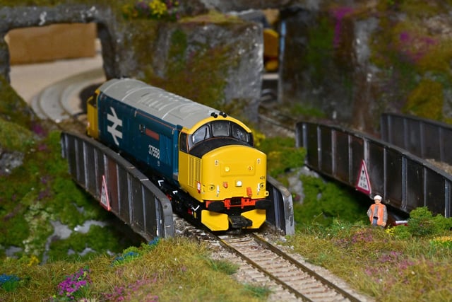 A model locomotive crossing a bridge as part of another layoput at the Chesterfield Railway Modellers' exhibition